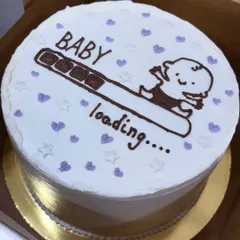 A cute and simple "Baby loading..." cake. This hand-drawn design is a fun and modern way to celebrate at a baby shower or to announce a pregnancy.