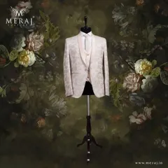 A vision in peach, this Italian suit features an intricate floral texture and a designer vest. It's a masterpiece of refined fashion for the groom who appreciates subtle yet impactful details.