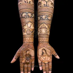 A complete view of a bridal mehendi featuring couple portraits on the palms. The design extends up the arms with traditional motifs like elephants and kalash, skills we cover when learning about composition.