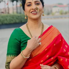 A beautiful close-up of Madhurani, showcasing the natural yet defined makeup look. The focus is on her expressive eyes and radiant smile.