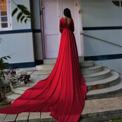 Another look at the dramatic trail on our red liquid silk gown. This is the ultimate dress for a pre-wedding shoot or a red carpet-style event.