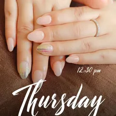 A closer look at the iridescent foil accent nails against the soft, natural nude base.