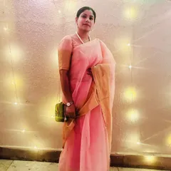 A lovely evening shot in my Durga Puja saree, with fairy lights creating a warm, magical glow.