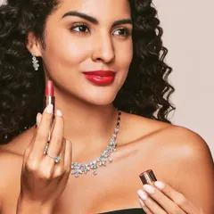 A classic Hollywood glam look for Aukera Jewellery, featuring a timeless red lipstick and winged eyeliner. This makeup style is perfect for making the diamond jewellery pop.
