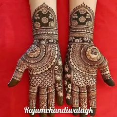 This is a classic, full-hand mehendi design that is very popular during festivals. The mix of geometric patterns and traditional motifs gives it a rich look.