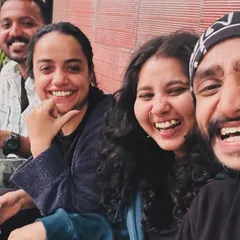 We are a vibe. We grow together. We grow deep. This is us, sharing a coffee and a laugh outside the studio. Come meet us.