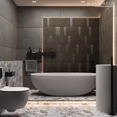 A full view of this modern bathroom highlights the harmony between different surfaces. The textured feature wall behind the tub contrasts beautifully with the smooth, large-format concrete-style tiles on the adjacent walls. Under-lighting on the terrazzo floor adds a warm glow, enhancing the room's sophisticated ambiance.