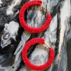 For a bold statement, I offer the same handcrafted hoop earrings in a vibrant red.