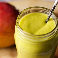 A jar of my bright and tangy Mango Lime Vinaigrette. This dressing is perfect for summer salads, made with real mangoes and fresh lime juice.