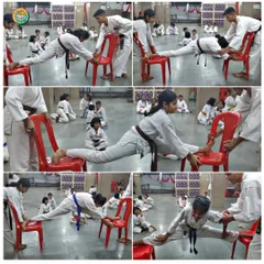 More students, including those with higher belts, demonstrate advanced flexibility by performing splits between chairs. This is a result of consistent practice.