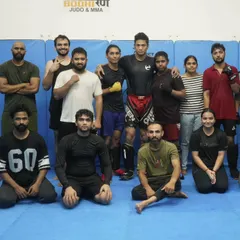 Where grit meets growth. A group photo after a tough MMA training session. We empower everyone to fight with heart and focus.