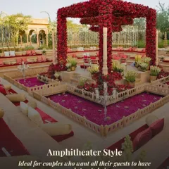 This amphitheater-style seating in Rajasthan ensures every guest has a perfect, unobstructed view of the central mandap. The structure is covered in crimson florals, creating a dramatic and royal atmosphere.