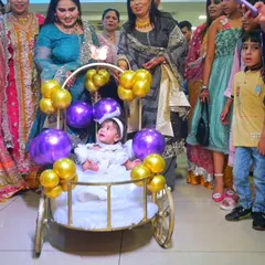 A wider view of the grand entrance, with family and friends looking on as the birthday girl arrives. I capture not just the main subject, but the reactions of the guests as well.