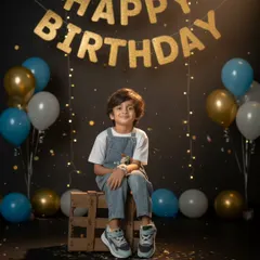 A classic birthday portrait with a "Happy Birthday" banner and balloons. I focus on making kids feel comfortable so their true personality shines through.