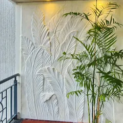 A different angle of the plaster-molded leaf sculpture. The three-dimensional texture interacts with natural and artificial light, creating depth and changing shadows throughout the day.