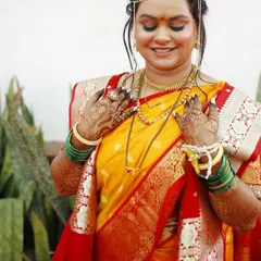 The pure happiness of a bride on her wedding day. This look for her Haldi ceremony features a yellow saree and glowing, natural makeup that lets her joy shine through.