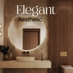 An elegant aesthetic is achieved through texture and light. This bathroom features a stunning textured wall behind a backlit circular mirror, a floating vanity, and wood paneling for a warm, organic feel.