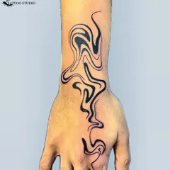 An abstract liquid flow design that moves from the wrist up the hand. This unique tattoo is all about movement and modern aesthetics.