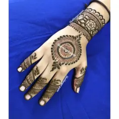 A lovely mandala design on the back of the hand with a floral cuff. This is a great option for someone who wants a traditional feel without the heavy coverage.