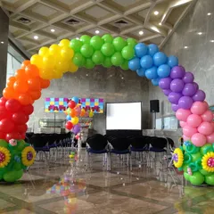 A classic rainbow balloon arch, perfect for adding a splash of color to any event. This large-scale installation is ideal for entrances at corporate family days or vibrant birthday parties.