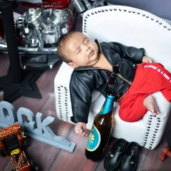 The aftermath of a rock and roll lifestyle. This shot captures the peaceful side of our little star, fast asleep on his mini armchair.
