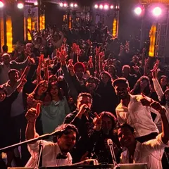 Another angle from a packed indoor club gig. The room is electric, with everyone's hands in the air. This is the intimate, high-energy party atmosphere we are known for creating.