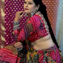A full view of a multi-colored, mirror-work Navratri lehenga, designed for maximum flair and movement.