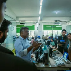 One of our senior engineers demonstrating a product to students. We encourage curiosity and questions, fostering an environment of learning and interaction during these facility tours.