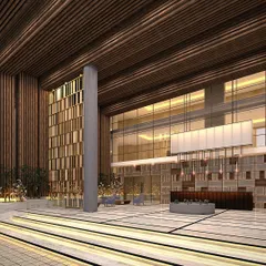 This 3D render showcases our design for a grand entrance lobby in a Yelahanka commercial property. We focused on creating a sense of scale and sophistication with double-height ceilings, rich wood textures, and layered lighting to welcome visitors.