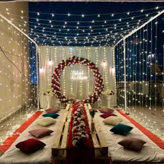 A wider view of the stunning fairy light canopy setup on a residential terrace. This is perfect for a private pajama party, bachelorette, or a musical night.