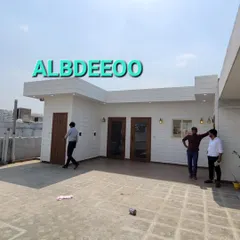 A series of photos of a completed prefab office on a terrace. These shots highlight the spacious exterior, the clean facade, and the professional interior, perfect for a startup or a corporate extension.
