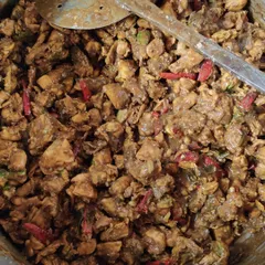 A large pot of chicken curry being prepared. I use fresh ingredients and a blend of spices to create rich, flavourful gravies that go well with both rice and bread.