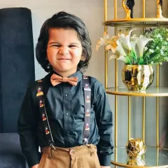 It's all about personality! This photo captures the fun energy of a kids' photoshoot. I ensure the clothing is comfortable enough for them to be themselves.