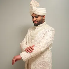 The complete royal groom look, featuring a beautifully tied turban and pearl necklace. My styling ensures that every element, from the makeup to the accessories, comes together perfectly.