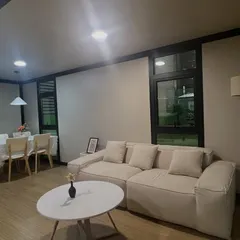 The interior of our two-story container home feels spacious and modern. This living and dining area shows how we use smart layouts and contemporary furniture to create a comfortable and functional home.