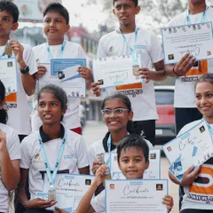 Every participant is a winner. Kids proudly show off their certificates and medals after completing the walkathon.