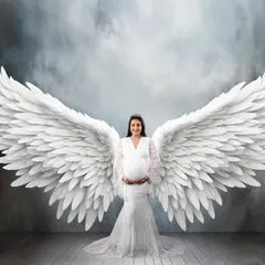 For a truly magical memory, I create fine art portraits like this one. With beautiful angel wings and dramatic lighting, I can turn your maternity photo into a breathtaking piece of art that feels truly special.