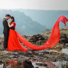 This fiery red gown is all about passion and drama. The extra-long trail is designed to catch the wind, creating breathtaking, cinematic shots.