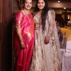 A stunning reception look for the groom's mother and sister. I designed two distinct yet complementary styles, a classic saree look for the mom and a glamorous lehenga look for the sister, ensuring they both felt fabulous.