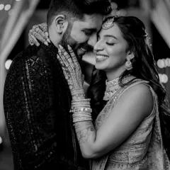 In the quiet moments between the grand celebrations, true feelings shine the brightest. This black and white portrait from Zaee and Kartik's Sangeet is all about their genuine connection and happiness.