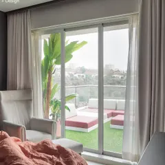 Waking up to this view is a luxury in itself. This shot from the master bedroom of Project 22 Days shows the seamless transition from a cozy indoor space to an expansive outdoor lounge area.
