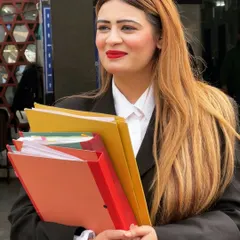 The reality of litigation is in the details. Here I am, files in hand, fully prepared with the paperwork and research necessary to build a strong case. Every page represents hours of dedication to my client's cause.