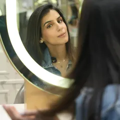 A moment of reflection after a rejuvenating hair spa. Our client enjoys her newly refreshed and glossy hair, feeling recharged and ready for the week ahead.