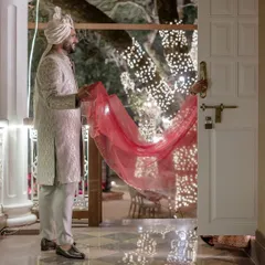 Between their wedding and afterparty, Maahir helps Sanjana with her veil. This quiet, tender moment of care, away from the crowd, is a beautiful example of the small gestures that mean so much.