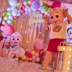 This is a perfect example of how our Cocomelon JJ mascot completes a first birthday party theme. The mascot fits right in with the decorations, creating a magical experience and perfect photo opportunities for your little one.