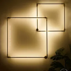 Embrace minimalist design with these geometric square wall sconces. The clean lines and soft, indirect backlighting create a subtle yet striking artistic statement, perfect for adding ambient light to hallways, bedrooms, or modern living areas.