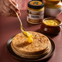 A product in its perfect setting. For Aazol's D2C ghee, we showed it being generously added to a hot paratha, an image that instantly communicates taste, tradition, and the simple pleasure of home-cooked food.