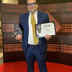 I am holding the certificate and trophy after being named in the Forbes India Top 100 Lawyers Legal Powerlist. This recognition is a testament to the successful outcomes we have achieved for our clients in complex legal battles.
