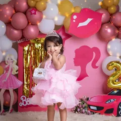 Posing like a true star. Her adorable expression and pose perfectly capture the fun and fantasy of our Barbie-themed photoshoots.