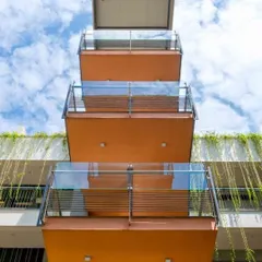 A duplicate image of the 'Poetree' balconies against a bright blue sky, highlighting the project's cheerful and modern aesthetic.